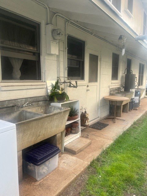 a house with two sinks and a table outside